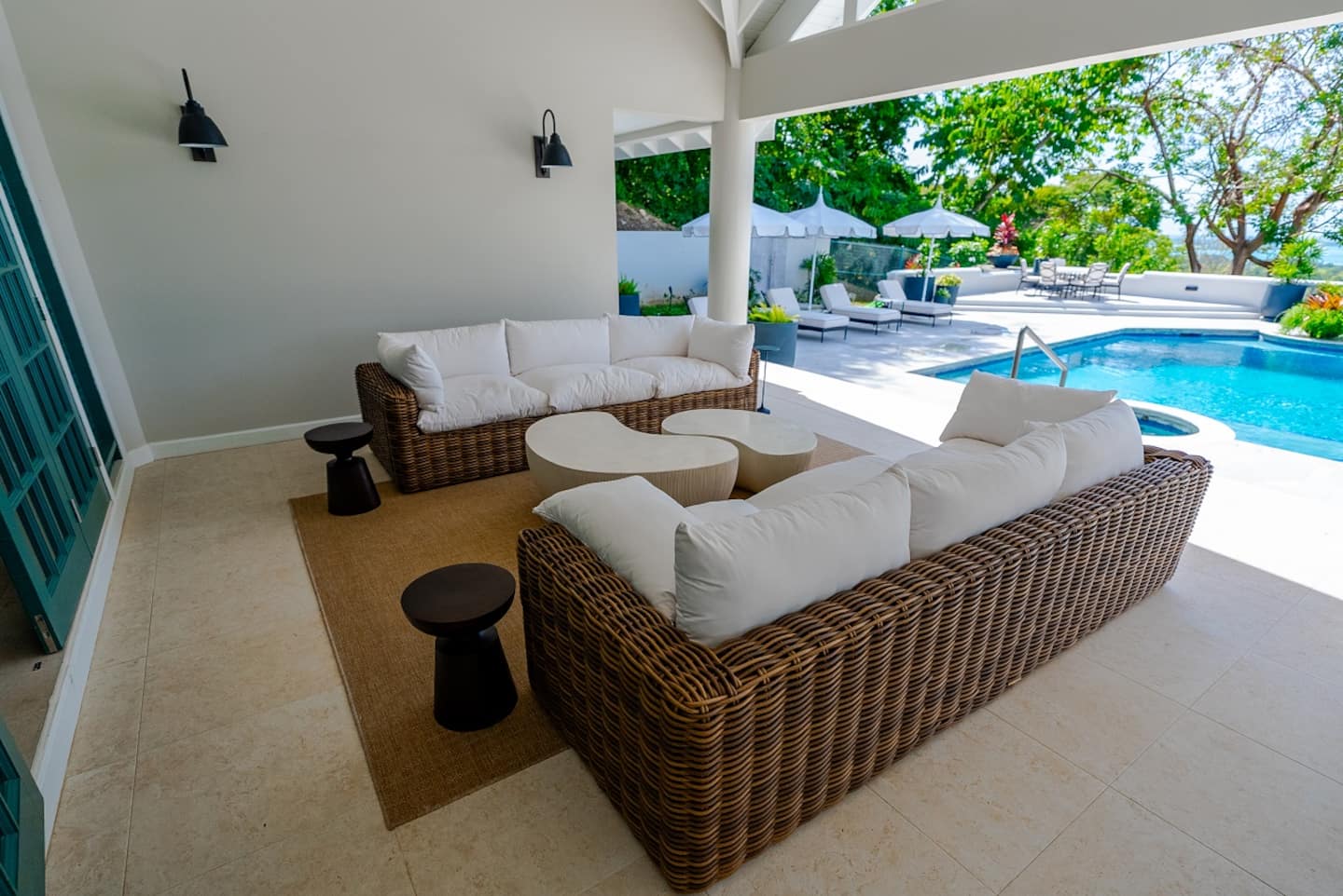 Shaded terrace lounge beside the pool